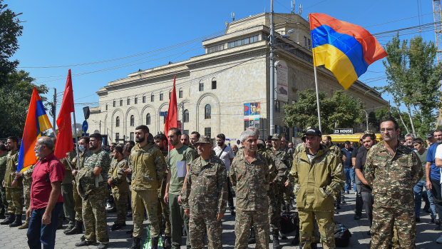 The Armenian government declared martial law on Sunday and mobilised service personnel and volunteers to set off for Nagorno-Karabakh.