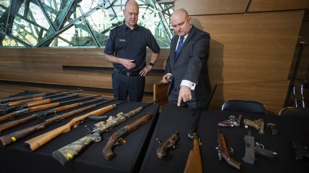 Assistant minister for customs Jason Wood with with Senior Sergeant Steve Farrar after announcing the gun amnesty.
