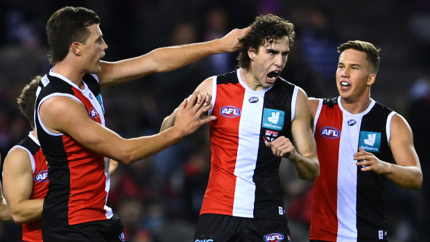 Max King is congratulated by teammates after kicking a goal during Friday’s clash against the Cats.