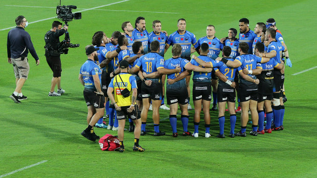 Better together: Force players form a huddle after their win over the Reds on Friday night.
