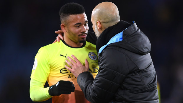 Pep Guardiola embraces Gabriel Jesus after City's victory against Leicester City at The King Power Stadium.
