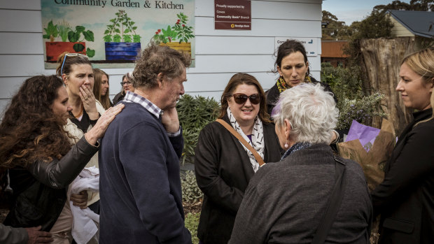 Minister for Women Natalie Hutchins meets Samantha Fraser's father Trevor (left) and Cowes residents on Saturday.