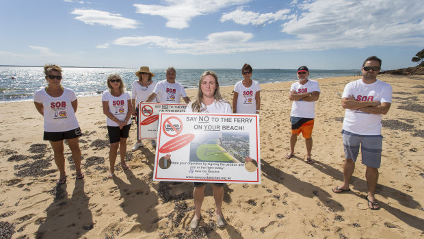 Kasey Burrell and members of the Save Our Beaches group on Osbourne Beach.