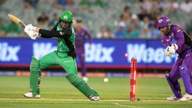 Ben Dunk of the Melbourne Stars is bowled by D'arcy Short of the Hobart Hurricanes.