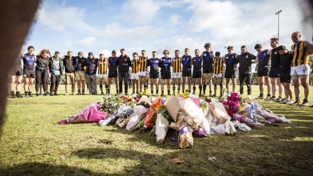 16/6/18 Local football players from St Bernards and Melbourne University Blacks offered a minutes silence at a temporary memorial for Eurydice Dixon, after finishing their match at Princes Park. 