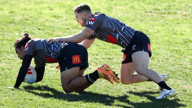 Hudson Young tackles Jarome Luai during a training session at Coogee on Wednesday.