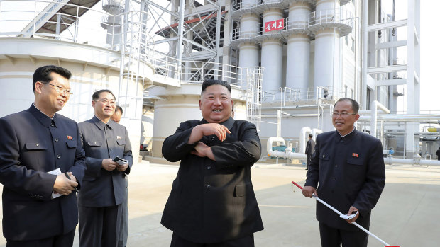 Kim Jong-un, centre, visits a fertiliser factory in South Pyongan, near Pyongyang, North Korea, on Friday.