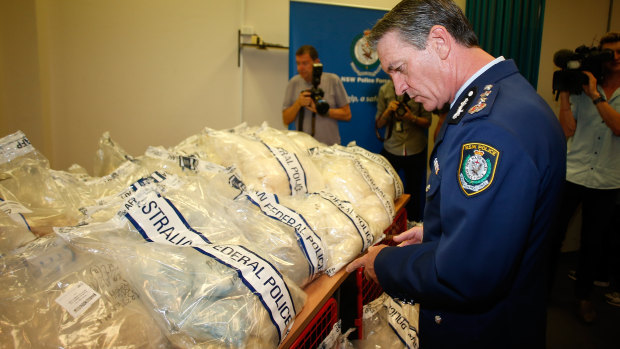 Former NSW Police commissioner Andrew Scipione in 2014 inspects the drug haul at the centre of the case.