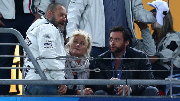 Russell Crowe, Deborra-Lee Furness and Hugh Jackman talk before an NRL match in 2012.