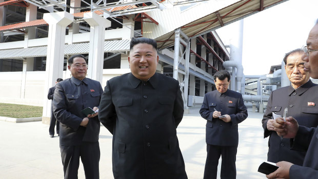 North Korean leader Kim Jong-un, centre, visits a fertiliser factory in South Pyongan, near Pyongyang, North Korea.