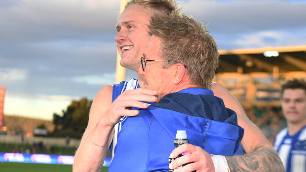 Jaidyn Stephenson and David Noble celebrate North Melbourne’s win over the Gold Coast.