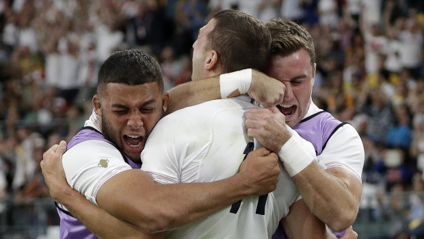 Killer blow: Jonny May, centre, celebrates his try that changed the match's momentum.