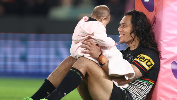 Jarome Luai with daughter Akira after clinching a place in the 2022 grand final.