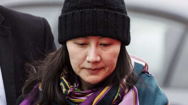 Huawei chief financial officer Meng Wanzhou arrives at a parole office with a security guard in Vancouver in December.