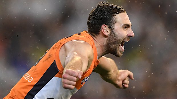 Flying: Jeremy Finlayson of the Giants celebrates kicking a crucial goal at the MCG.