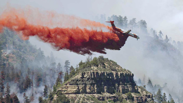An aircraft drops fire retardant on the fire in the mountains near Durango, Colorado. Fires in the south-west of the state continue to burn largely out of control. 