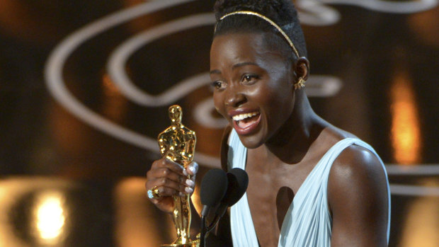 Lupita Nyong’o receives an Oscar for best actress in a supporting role for 12 Years a Slave. 