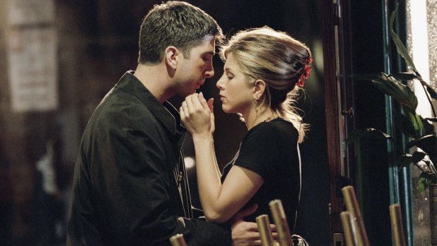 Rachel and Ross (aka Jennifer Aniston and David Schwimmer) share a kiss on the set of Friends.