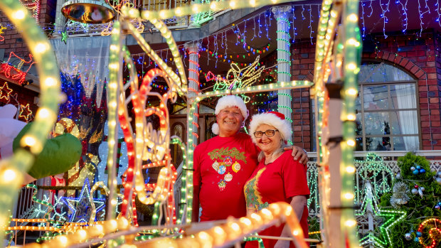 Tony & Mathilde Filippini out the front of their brightly lit home in Thomastown.