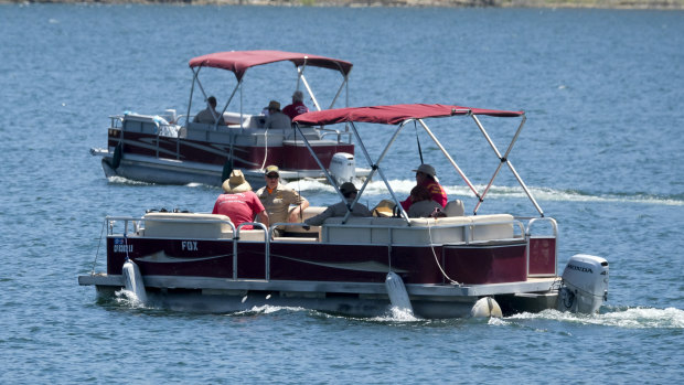 Members of the Ventura County Sheriff's Office on the lake on Monday.