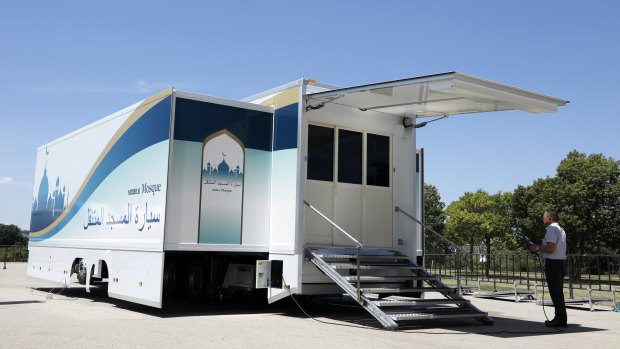 A staff member operates Mobile Mosque during an unveiling event  in Toyota, western Japan.