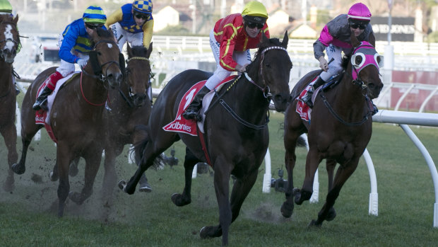 Voodoo Lad moves into a winning position in the Ladbrokes Sir John Monash Stakes.