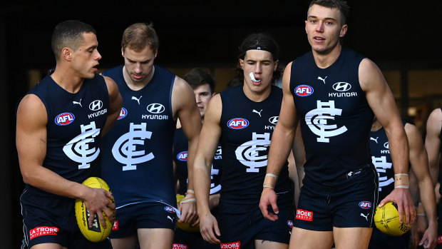 Patrick Cripps leads the Blues out for their clash against Geelong.