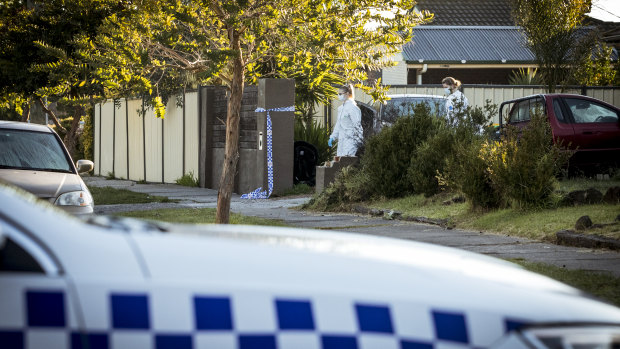 Forensic Police enter the site of an alleged murder at Epping. 