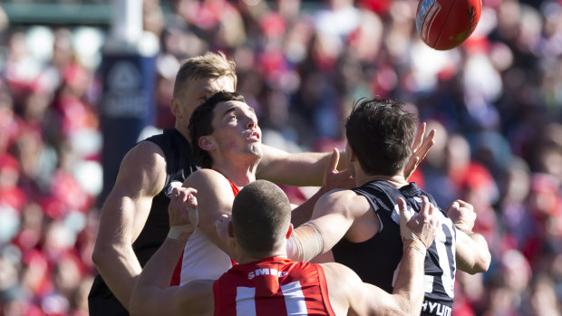 On point: Tom McCartin of the Swans takes a mark against the Blues.
