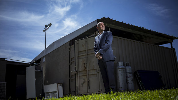 Greensborough Hockey Club president Greg Purcer outside his clubrooms, which he says are made up of two shipping containers joined to a shelter shed.
