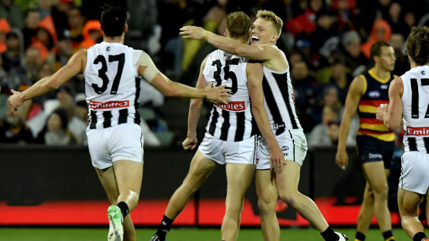 Jaidyn Stephenson and Adam Treloar celebrate a goal in the win over the Crows.
