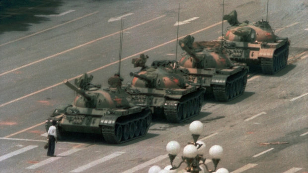 A Chinese man stands alone to block a line of tanks in Tiananmen Square in 1989.