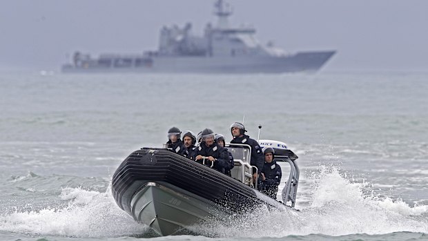 Crew from the HMNZS Wellington returning to shore on Monday.