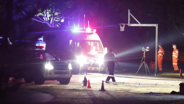 Police and SES volunteers search for evidence at Frascott Park after a 17-year-old was stabbed to death on Wednesday.