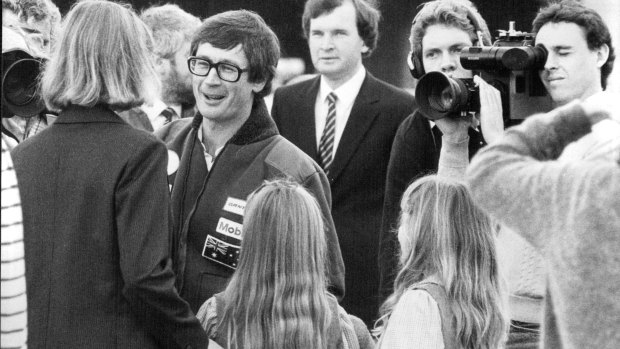 Smith waves to the crowd and his family as he takes off from Darling Harbour on the final leg of his round the world by helicopter trip in 1983. 