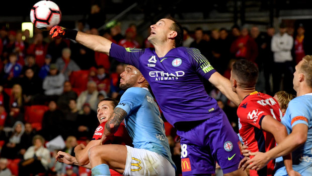 Full stretch: Shotstopper Eugene Galekovic punches clear for Melbourne City.