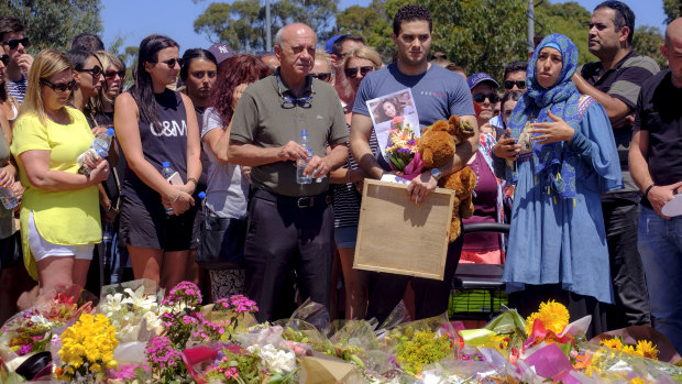 Saeed Maasarwe, the father of slain student Aiia Maasarwe, pays tribute to his daughter outside the Polaris shopping centre in Bundoora on Sunday. 
