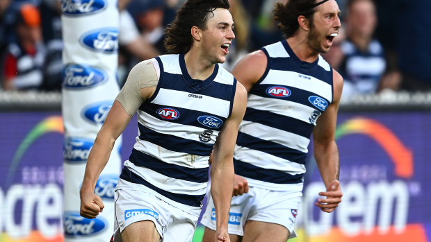 Jordan Clark of the Cats celebrates kicking a goal.