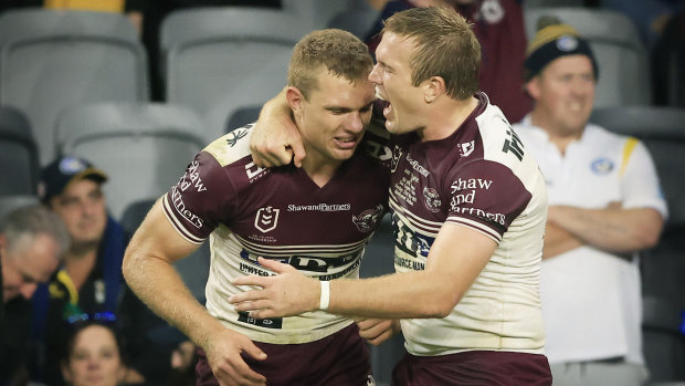 Jake Trbojevic, right, hugs brother Tom after Manly’s win over Parramatta on Sunday.