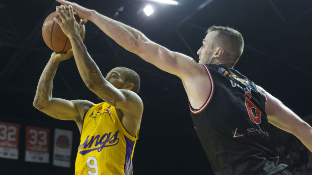 Stymied: Andrew Ogilvy of the Hawks blocks Jerome Randle at WIN Entertainment Centre.