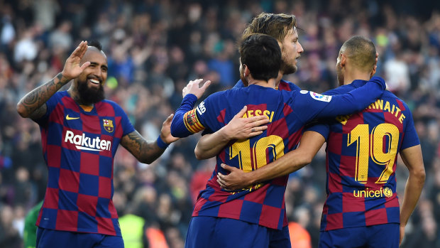 Lionel Messi celebrates with Martin Braithwaite, Arturo Vidal and Ivan Rakitic after scoring Barca's fourth goal.