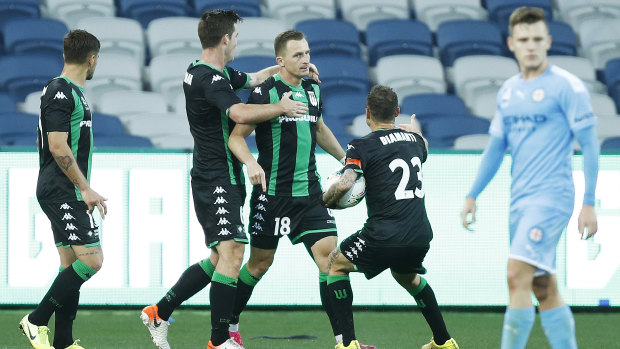 Spot on: Besart Berisha (centre) celebrates after converting his penalty to level proceedings for Western United.