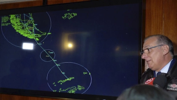 General Eduardo Mosqueira shows a map of the area where the plane went missing.