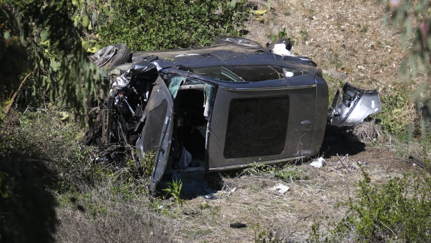 The vehicle rests on its side after a rollover accident involving golfer Tiger Woods along a road in the Rancho Palos Verdes section of Los Angeles. 