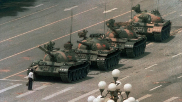 'Tank Man' trying to block a line of tanks heading to Tiananmen Square.
