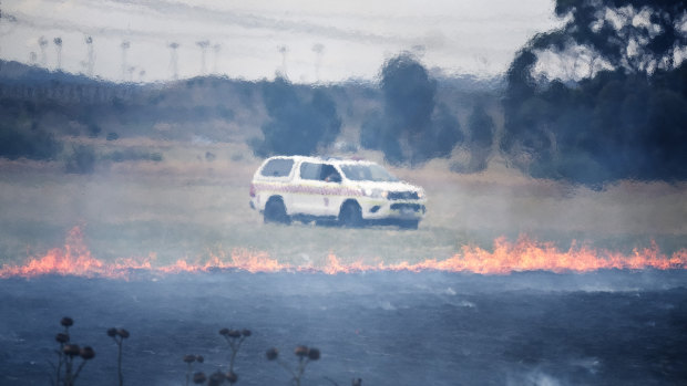 The grassfire burned at the side of the Calder Freeway on Monday.
