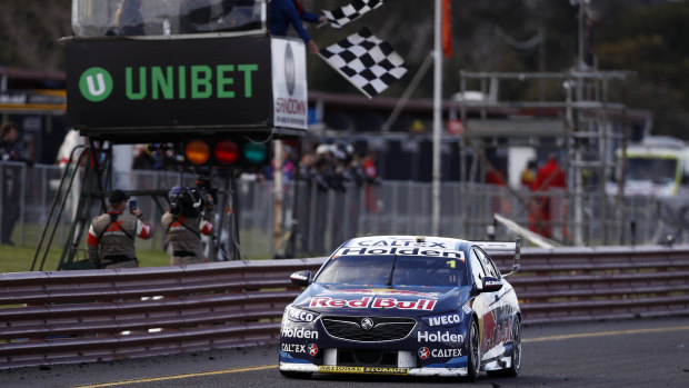 Line honours: Jamie Whincup takes the chequered flag in the Red Bull Holden Racing Team Commodore in race 24 of the 2018 Virgin Australia Supercars Championship at the Sandown 500 on Sunday.