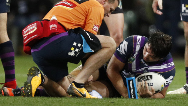Another blow: Brandon Smith receives medical attention for his right knee at AAMI Park.