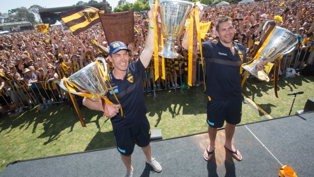 Alastair Clarkson at Hawthorn with captain Luke Hodge and three premiership cups.