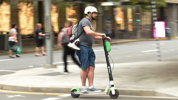 A Lime scooter user on the streets of Brisbane last week.